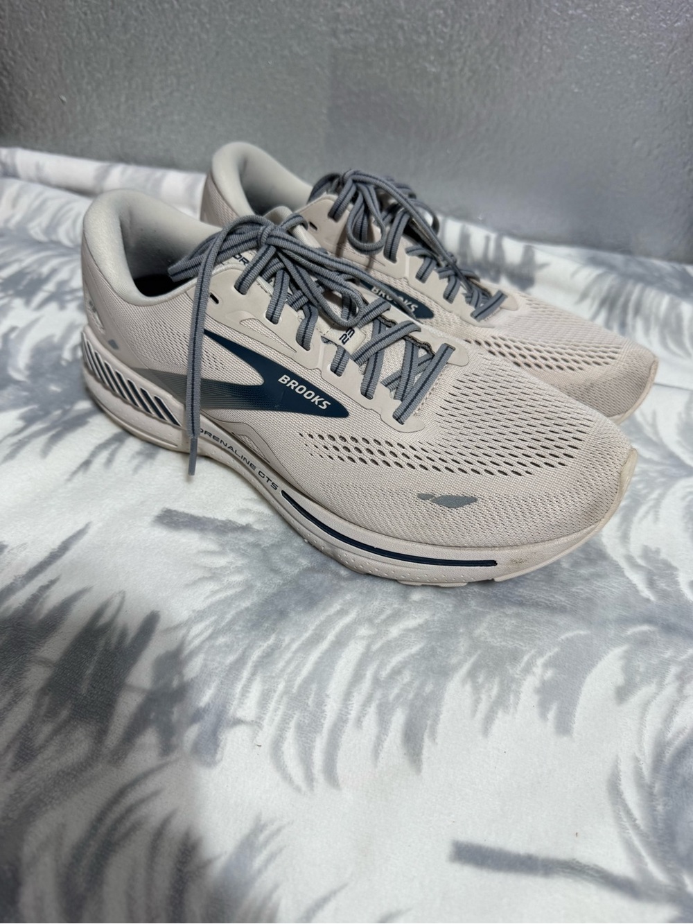 Brooks beige and navy running shoes